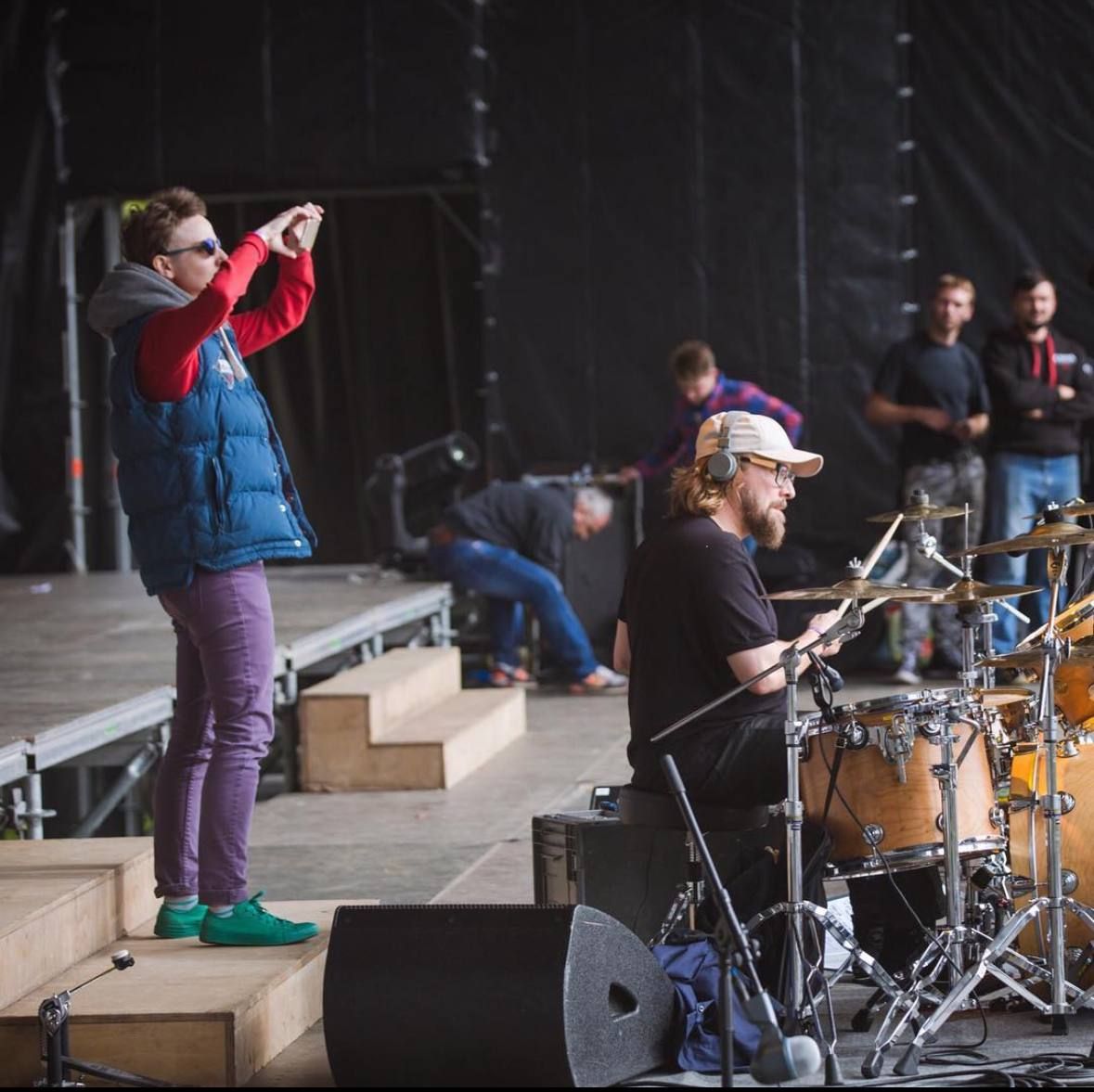 Maria on stage during a sound check, with a drummer